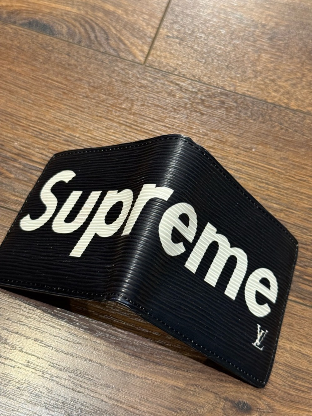 Black Wallet with White 'Supreme' Logo